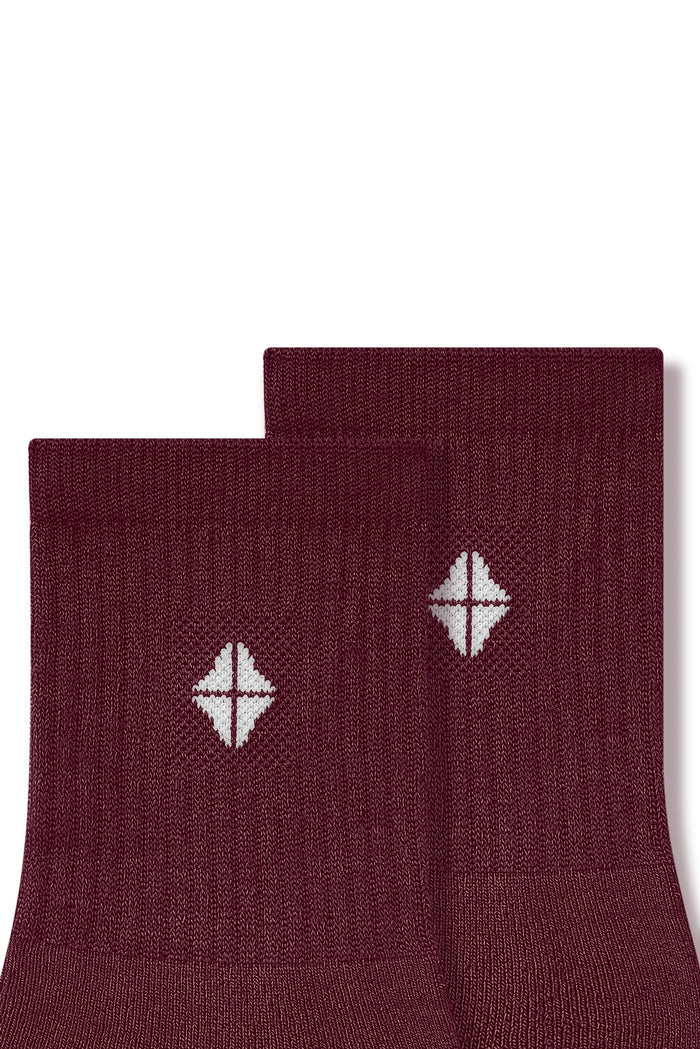 Adult Crew Socks in Burgundy close up on a white background.