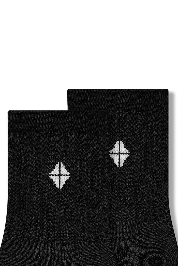 Close up of Adult Crew Socks in Midnight laying flat on a white background.