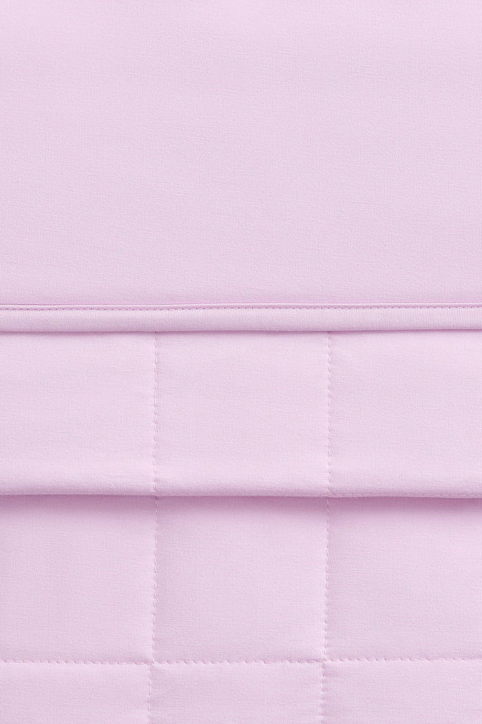Close-up of a light purple bamboo quilt