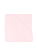 Solid light pink color blanket on a white background