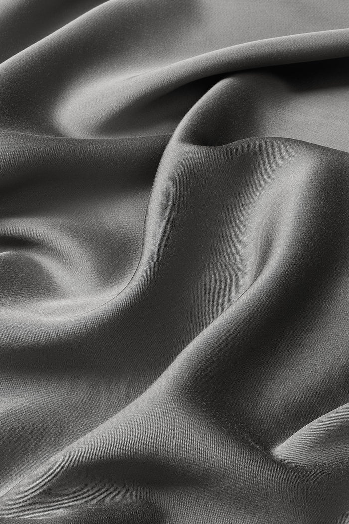 Close up of the bamboo sateen fabric: A warm charcoal grey
