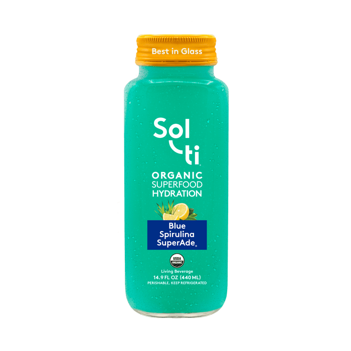 Sol-ti Blue Spirulina SuperAde glass bottle with a transparent front label, in  light background.