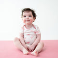 Young toddler wearing Bodysuit in Bow