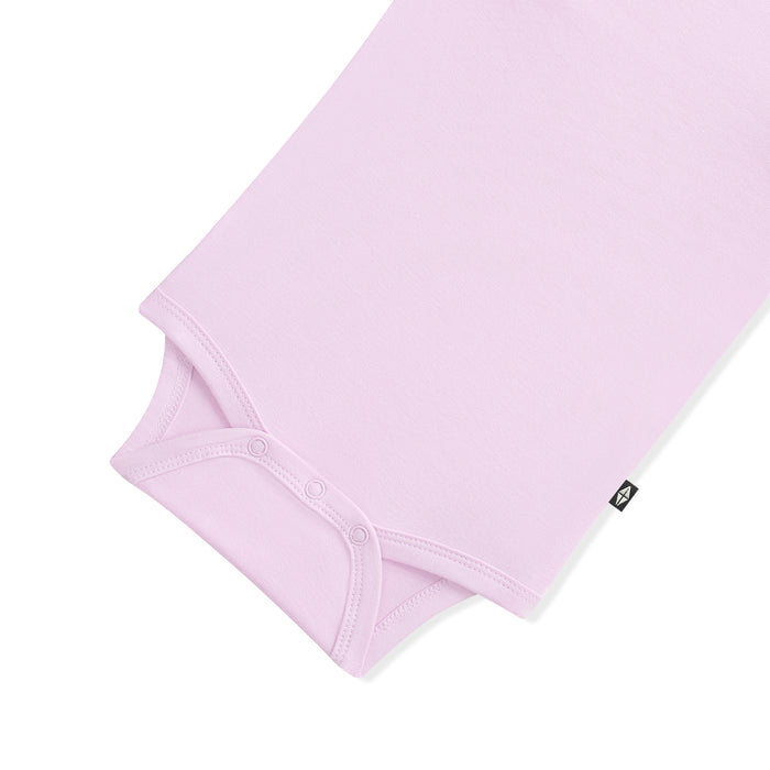 Light purple baby bodysuit with snap closures on a white background