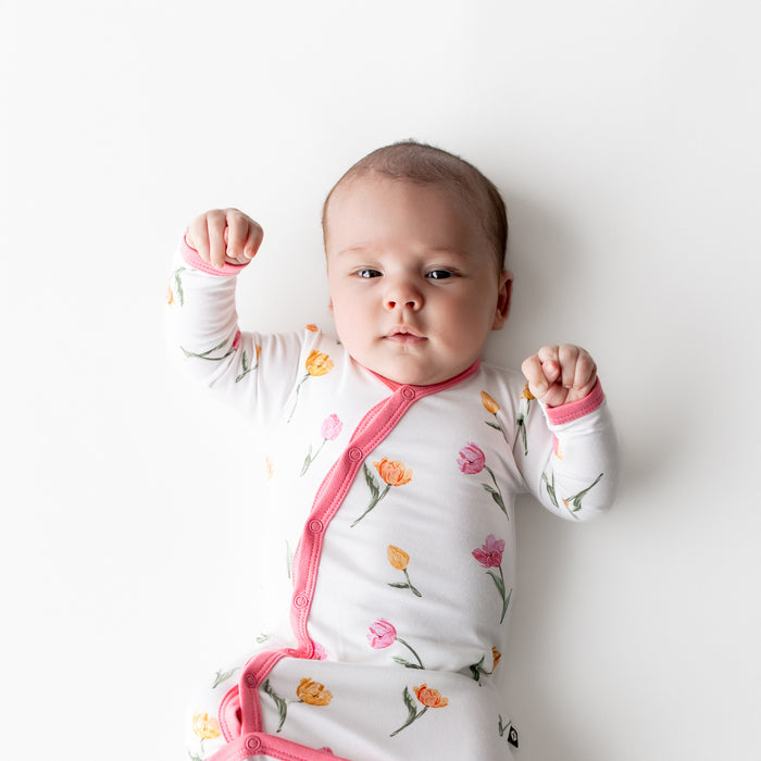 Close up of newborn wearing the Bundler in Tulip