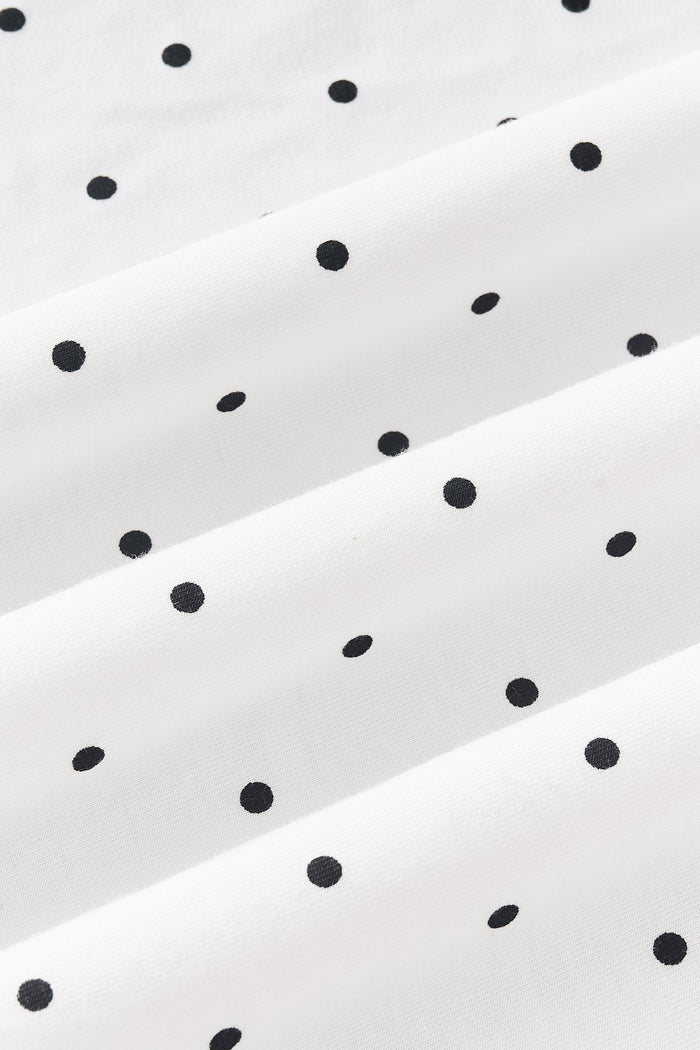 Close up of Midnight Polka Dot print on white fabric