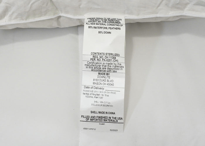 The Pillow Factory Downlite 50/50 Waterfowl Feather/Grey Down Pillow is a white medium support pillow with a sewn-in tag listing sterilization, 50% down, 50% waterfowl feathers, certifications, delivery date; shell made in China.