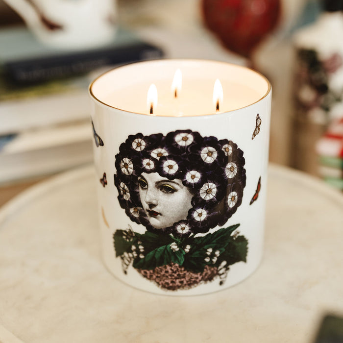 Eden 3 Wick Scented ceramic candle lit, showing the warm glow of the flame in the fine china vessel