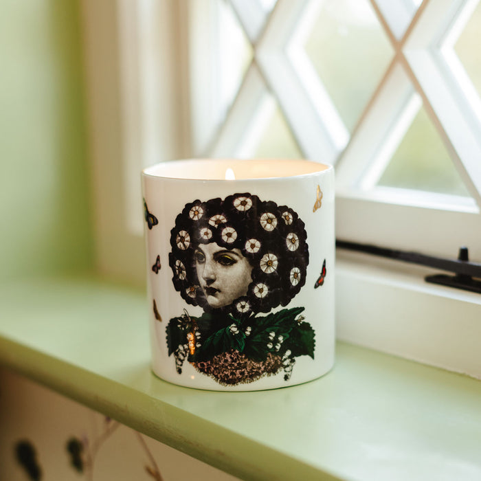 Eden ceramic candle, close-up of the hand-decorated illustration and 22ct gold rim