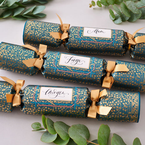 "Golden Ivy" Place Name Luxury Christmas Crackers Christmas crackers arranged on a festive table setting