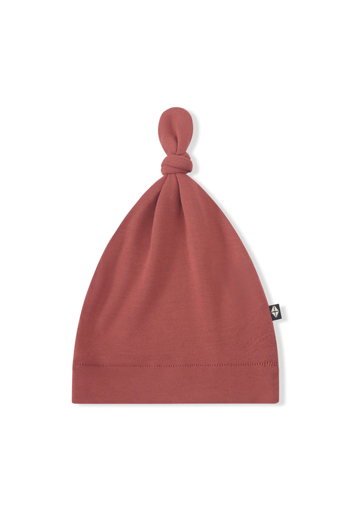Knotted Cap in Ember on a white background