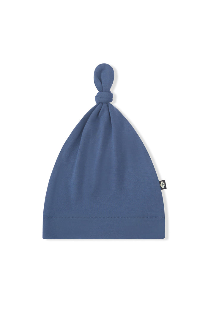Knotted Cap in Oxford on a white background