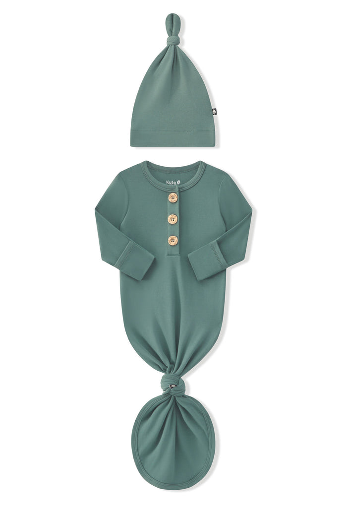 Arms of the Long Sleeve Bodysuit in Pine folded inward showing the fold over hand cuffs on a white background