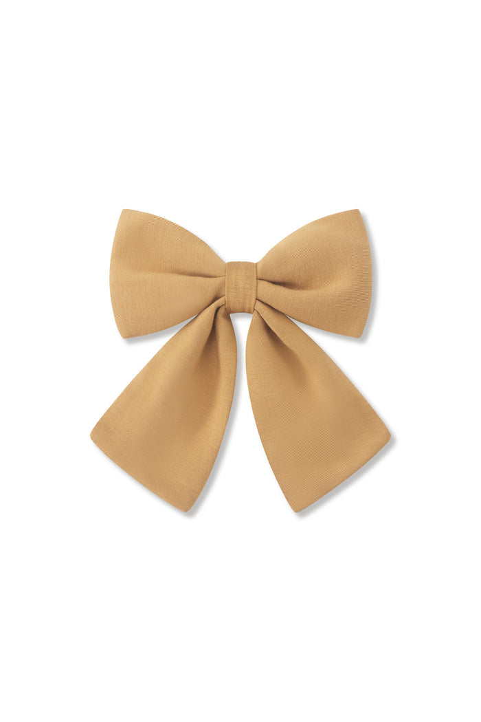 Large Alligator Clip Bow in Ochre on a white background