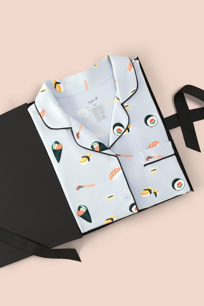 Long-Sleeved Women's Pajama Set in Ice Sushi print packed in a box on a beige background