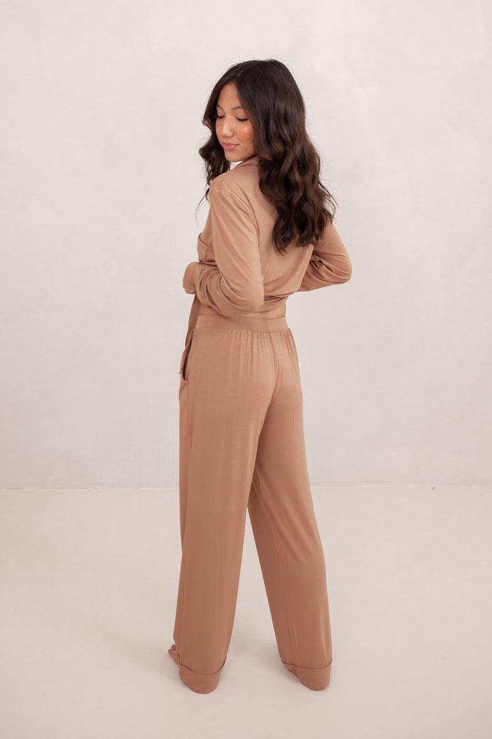 The back of the Long-Sleeved Women's Pajama Set in Latte with Latte Trim shown on a female model