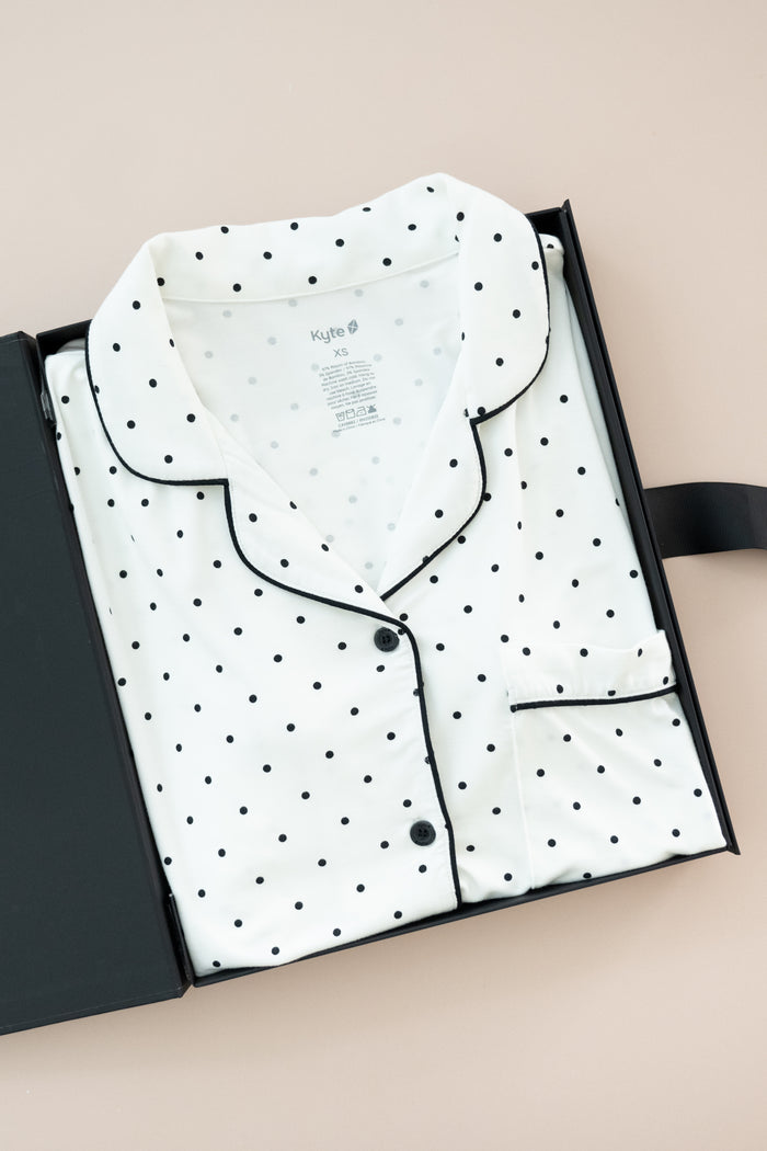 Long-Sleeved Women's Pajama Set in Midnight Polka Dot print packed in a box on a beige background