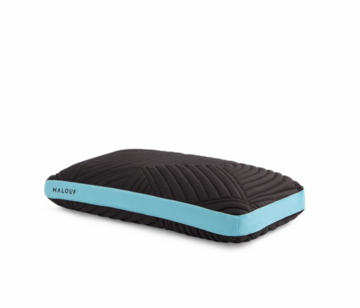 The Malouf Ice Cloud™ Pillow in a rectangular shape with a quilted black design is shown. This plush memory foam pillow features a turquoise blue band running along one of its shorter sides, near the edge. The brand name "Malouf" is printed in white on the turquoise band at the corner of the pillow.