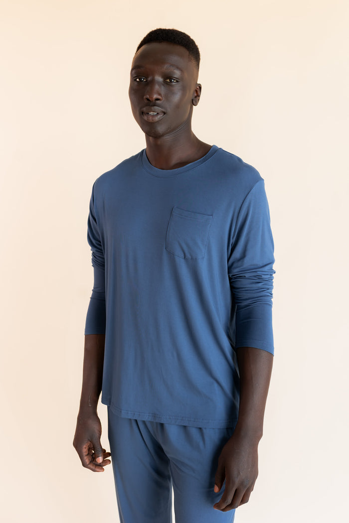 Model wearing Men's Jogger Set in Oxford on a beige background
