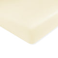 Mini Crib Sheet in Chamomile shown on a mattress