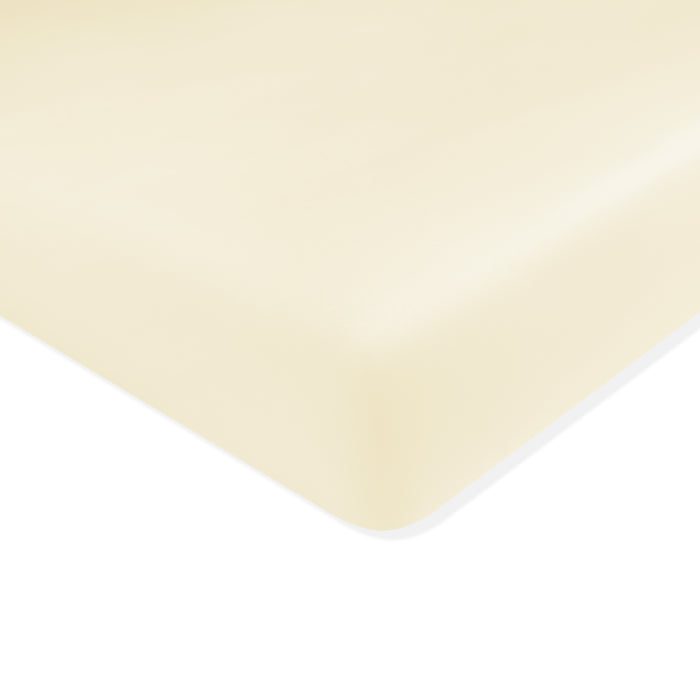 Mini Crib Sheet in Chamomile shown on a mattress