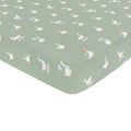 Corner of the Mini Crib Sheet in Silly Goose shown on a mini crib mattress