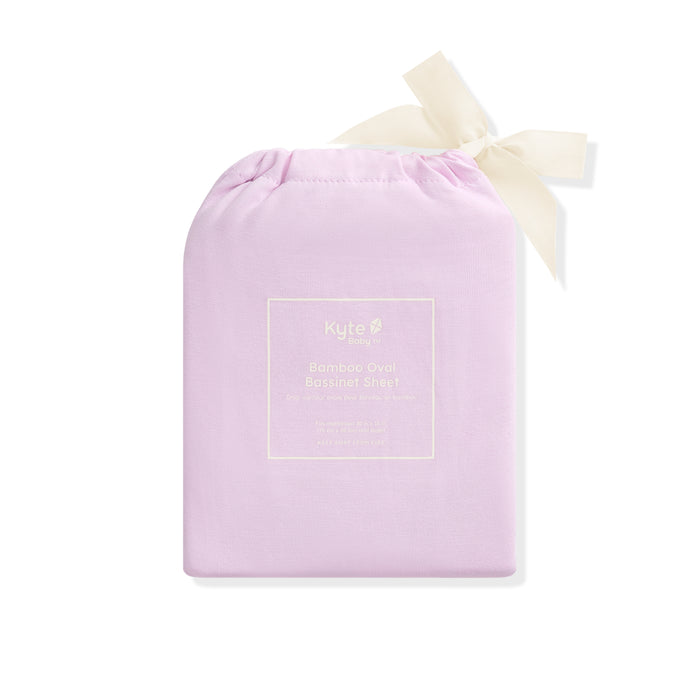 Purple drawstring bag with a white bow on a white background