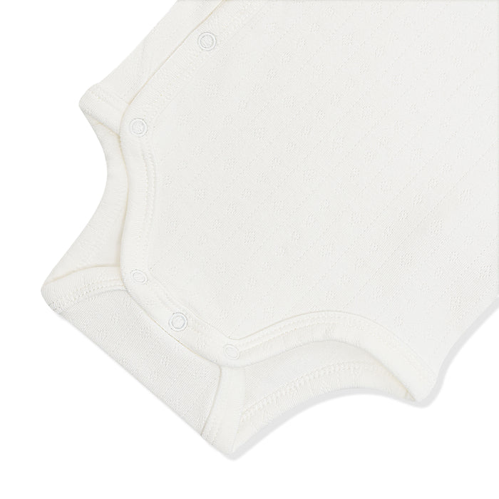 Close up of the snap closures on the inseam of the Pointelle Kimono Bodysuit in Cloud