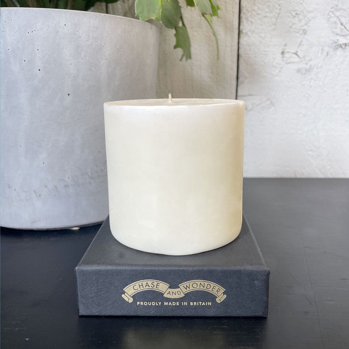 Refill for The Dashing Gent ceramic candle lit, showing the warm glow of the flame in the fine china vessel
