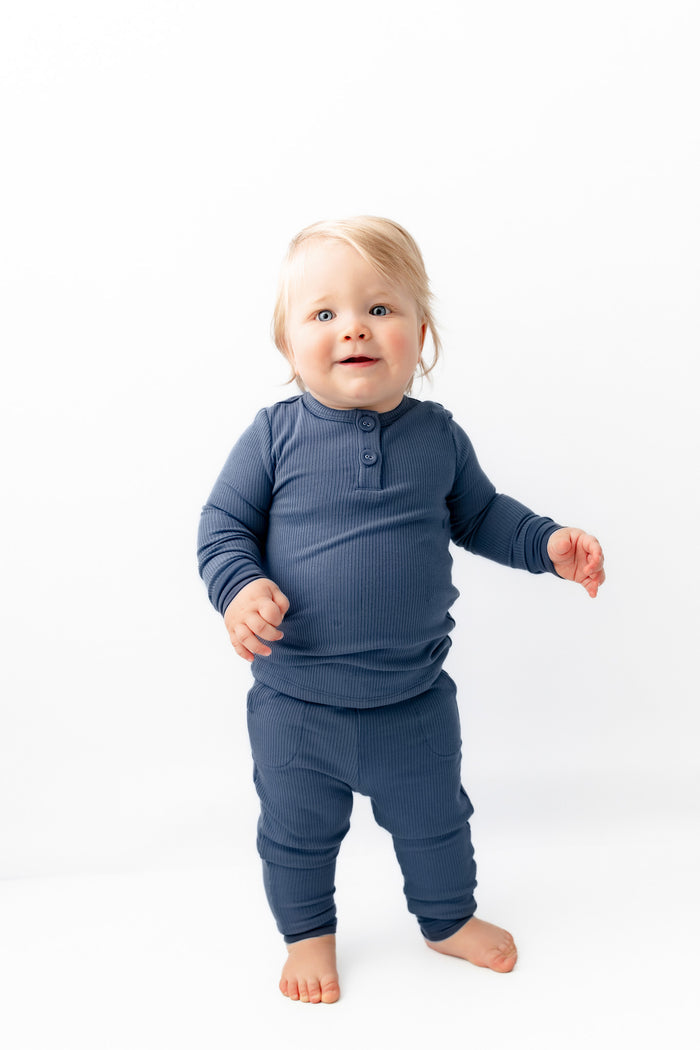 Baby wearing Ribbed Infant Henley Set in Oxford on a white background