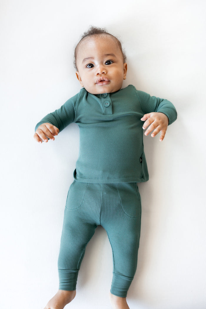 Baby wearing Ribbed Infant Henley Set in Pine on a white background