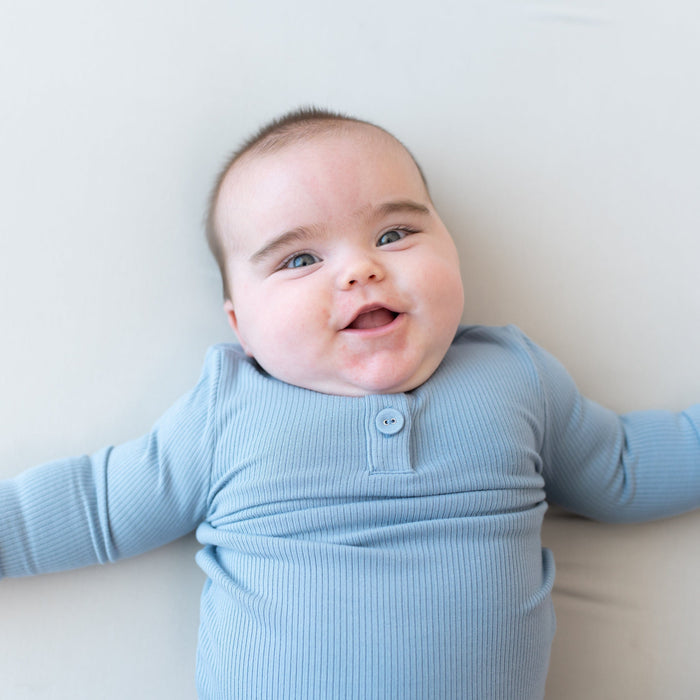 Child wearing Kyte Baby Bamboo Ribbed Infant Henley Set in Slate