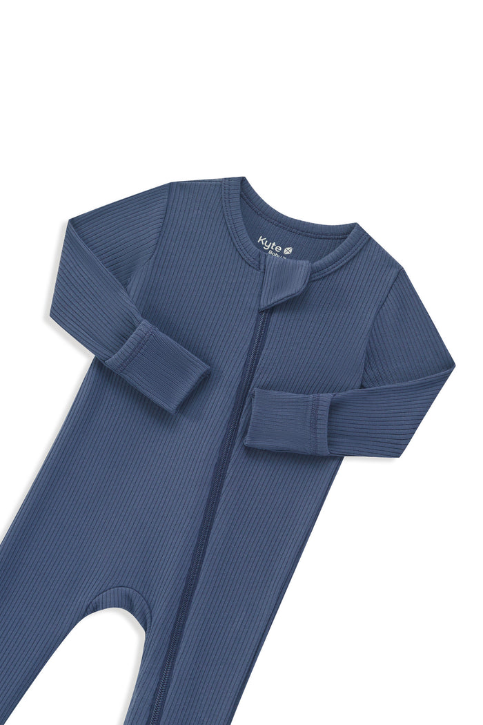 Zipper garage and fold over hand cuffs shown on the Ribbed Zipper Romper in Oxford on a white background