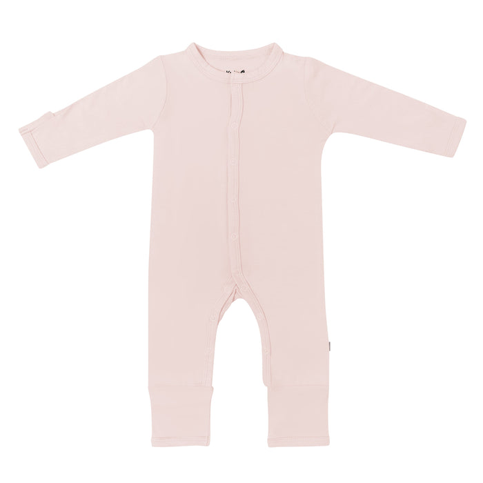 Flat lay of Kyte Baby Romper in Blush