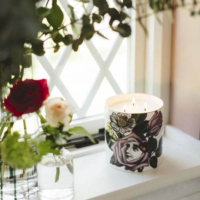 Rosa 3 Wick Scented ceramic candle lit, showing the warm glow of the flame in the fine china vessel