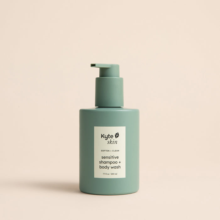 Green shampoo and body wash bottle with Kyte Skin label on a beige background