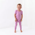 Toddler wearing Short Sleeve Pajamas with Pants in Poi pink