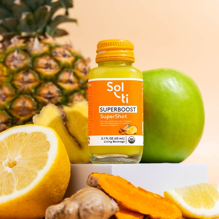 SUPERBOOST SuperShot bottle with front label with pineapple, green apple, ginger, turmeric, and lemon