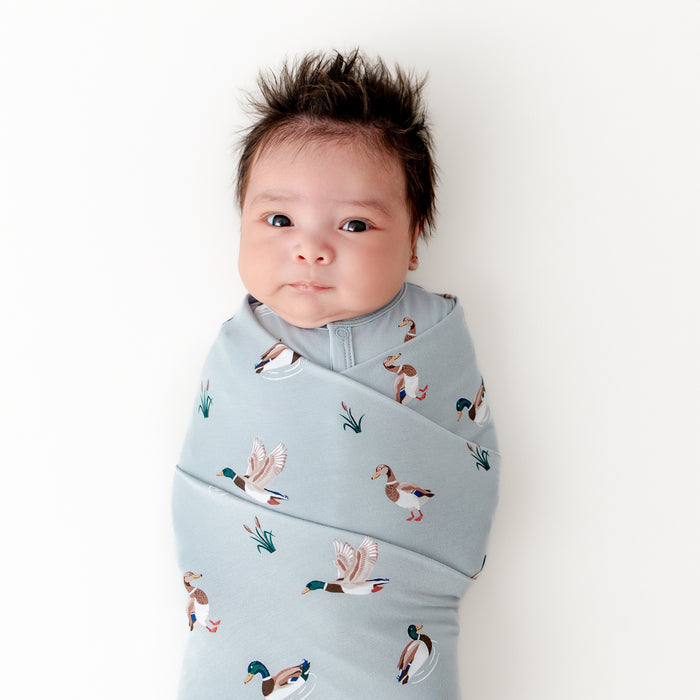 Close up  newborn swaddled in the Swaddle Blanket in Mallard Duck