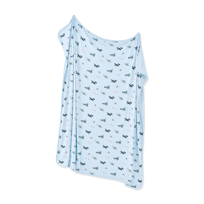 Swaddle Blanket in Take Off shown unswaddled