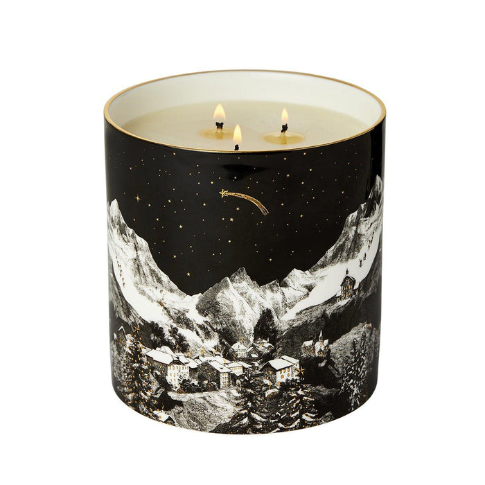 The Alpine Lodge 3 Wick Scented ceramic candle lit, showing the warm glow of the flame in the fine china vessel