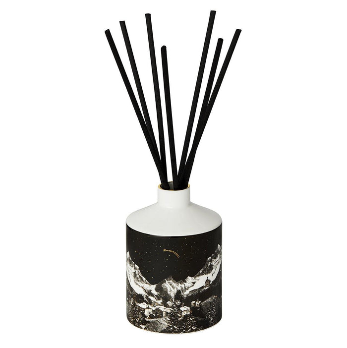 The Alpine Lodge ceramic reed diffuser, close-up of the hand-decorated illustration and 22ct gold