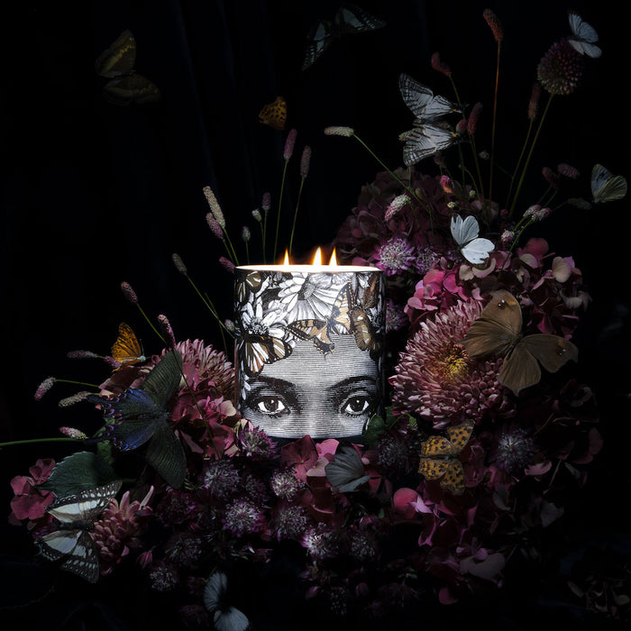 The Butterfly Lady 3 Wick Scented ceramic candle lit, showing the warm glow of the flame in the fine china vessel