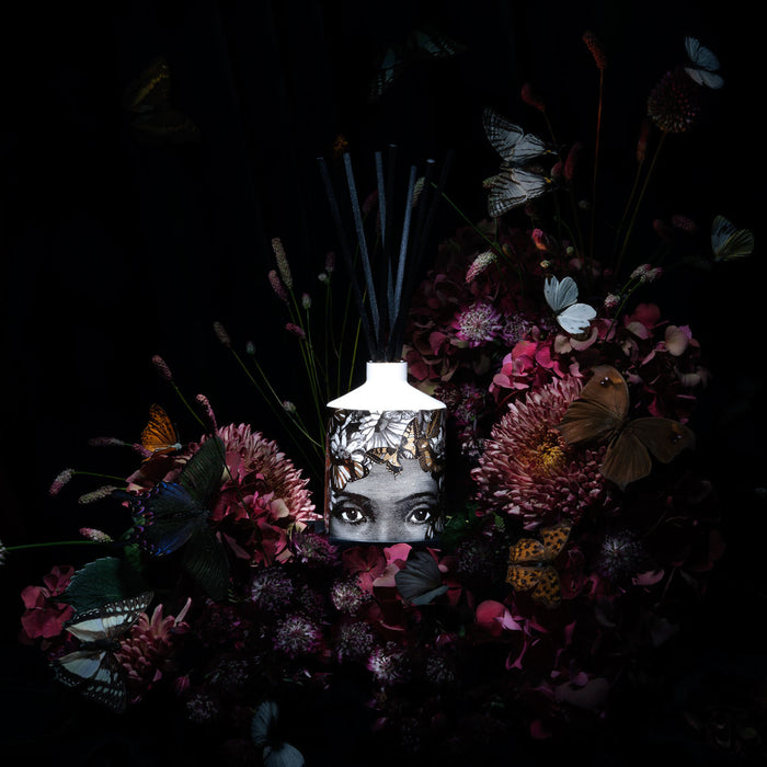 The Butterfly Lady ceramic reed diffuser, close-up of the hand-decorated illustration and 22ct gold