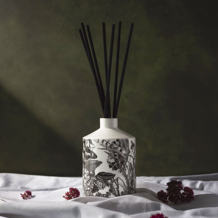 The Country Garden ceramic reed diffuser, close-up of the hand-decorated illustration and 22ct gold