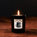 The Dashing Gent Luxury Scented Glass Candle by Chase and Wonder, elegant black glass vessel with gold lid
