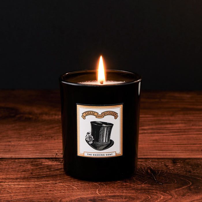 The Dashing Gent Luxury Scented Glass Candle by Chase and Wonder, elegant black glass vessel with gold lid