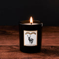 The Enchanted Forest Glass Candle by Chase and Wonder, elegant black glass vessel with gold lid