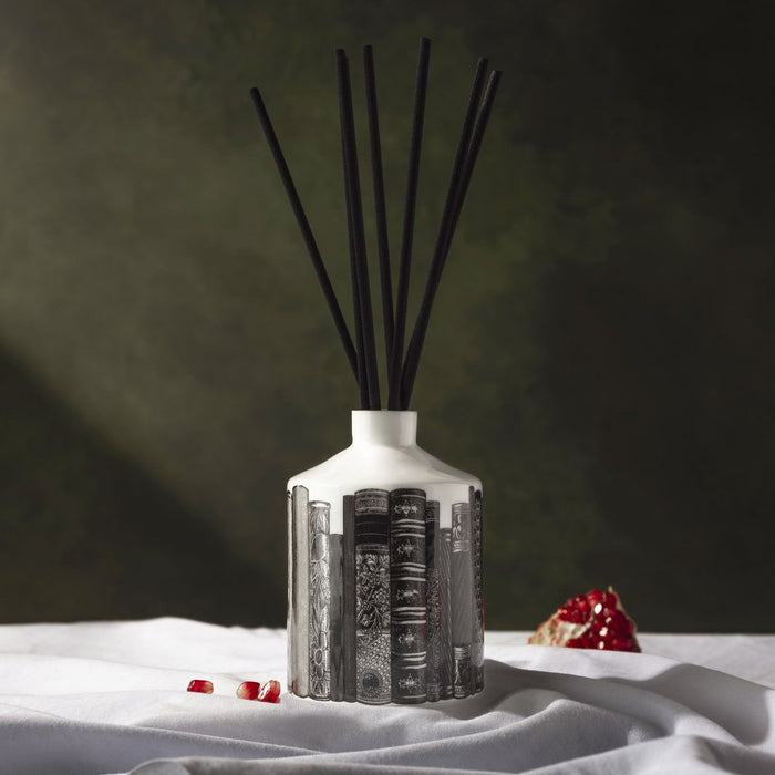 The Library ceramic reed diffuser, close-up of the hand-decorated illustration and 22ct gold