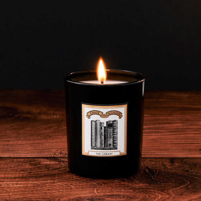 The Library Scented Glass Candle by Chase and Wonder, elegant black glass vessel with gold lid